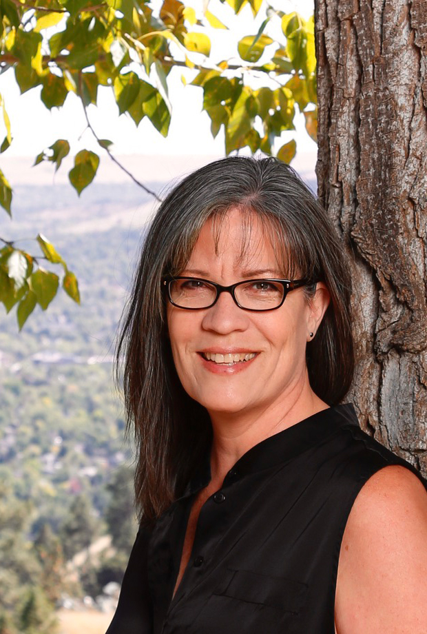 Photo of Acupuncturist Kat Talley, leaning on tree. Founder of Elemental Therapy in Boulder - another cropped version